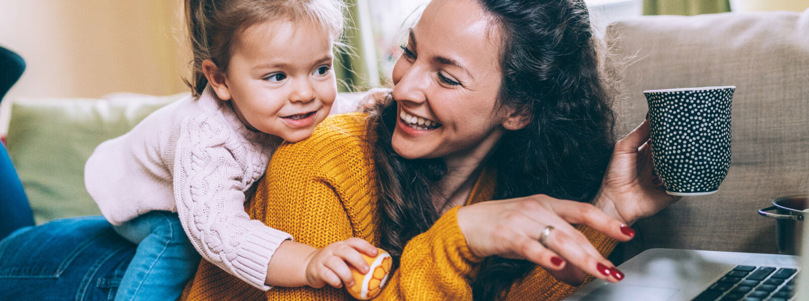 Woman and toddler on a couch