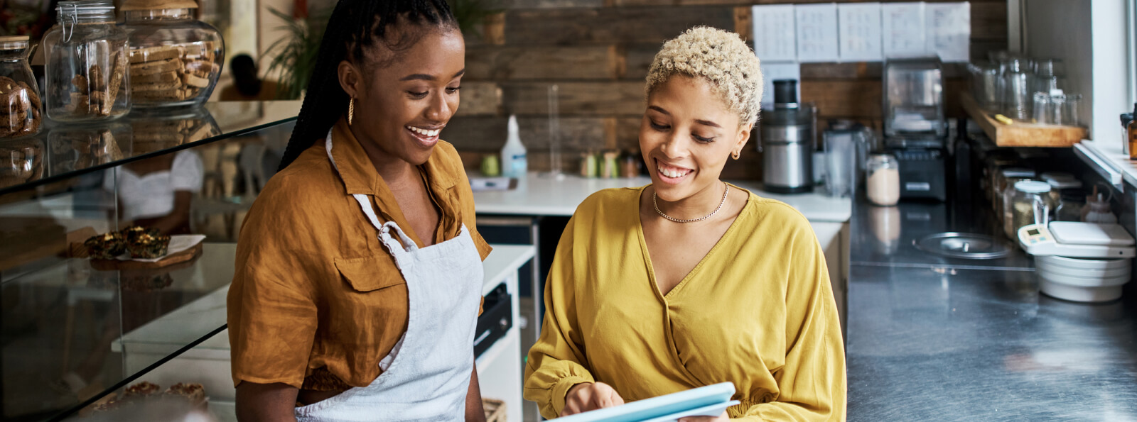 Two women working in a cafe