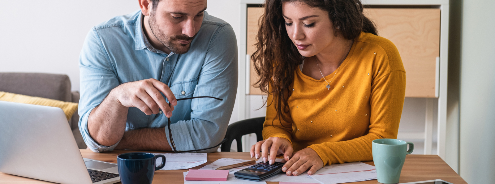 Two people using calculator